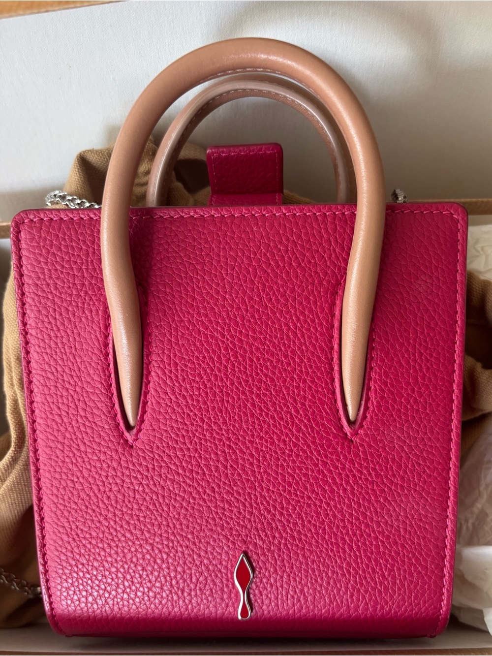 Christian Louboutin Cabata Mini Tote with Beige Handles and silver chain.